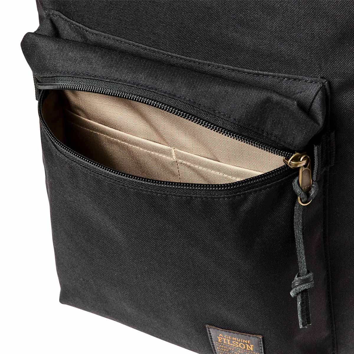 Filson Surveyor 25L Backpack Black, in the back of a pick-up truck